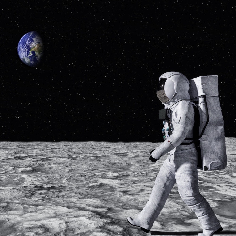 A man who wears a pace suit is walking on the Moon